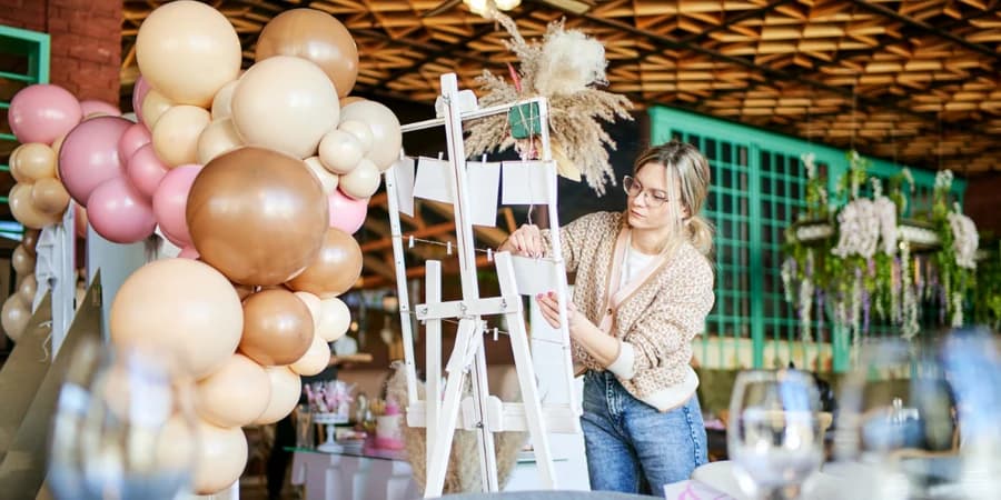 Colorful birthday party table setup with balloons and decor